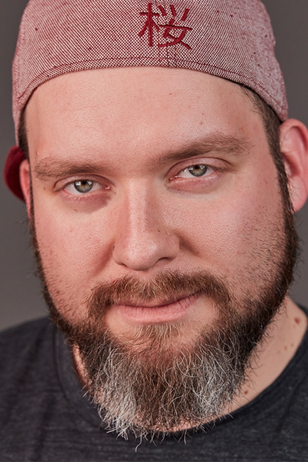 Photographer Dennis Weißmantel in a professional portrait.