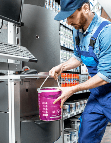 Retailer dispensing paint in store