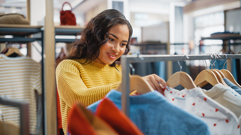 Woman shopping in a clothing store.
