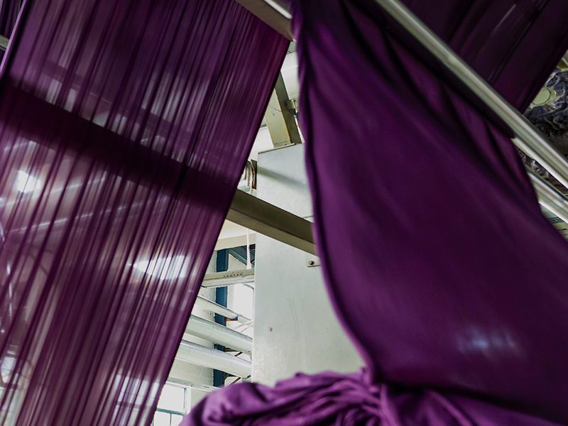 Purple yarn drying in dyeing facility