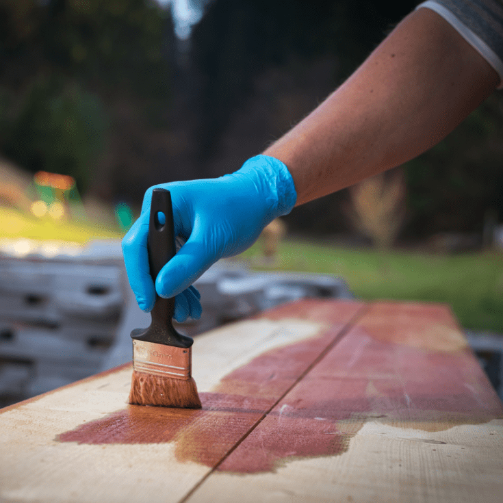 Wood planks being stained