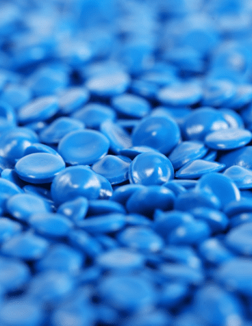 Blue plastic pellets used for manufacturing