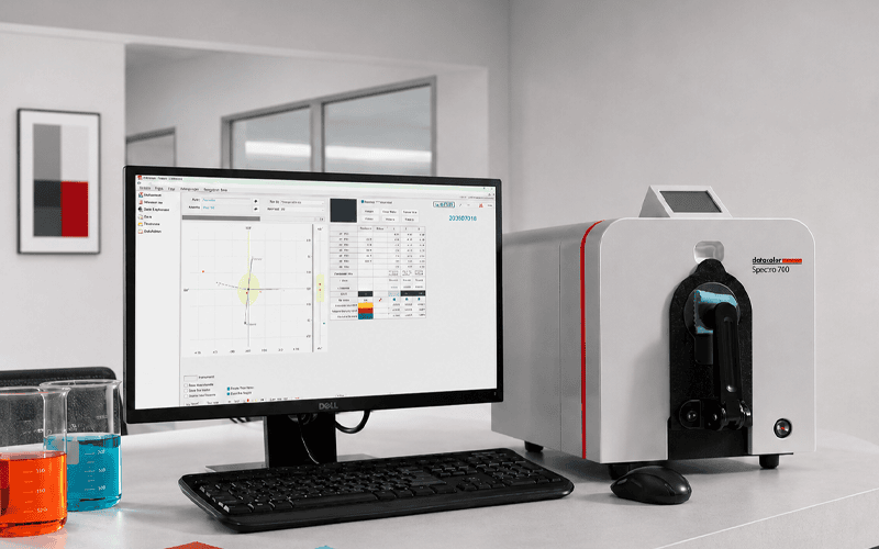 Textile Lab Manager managing colorful fabric within a textile laboratory